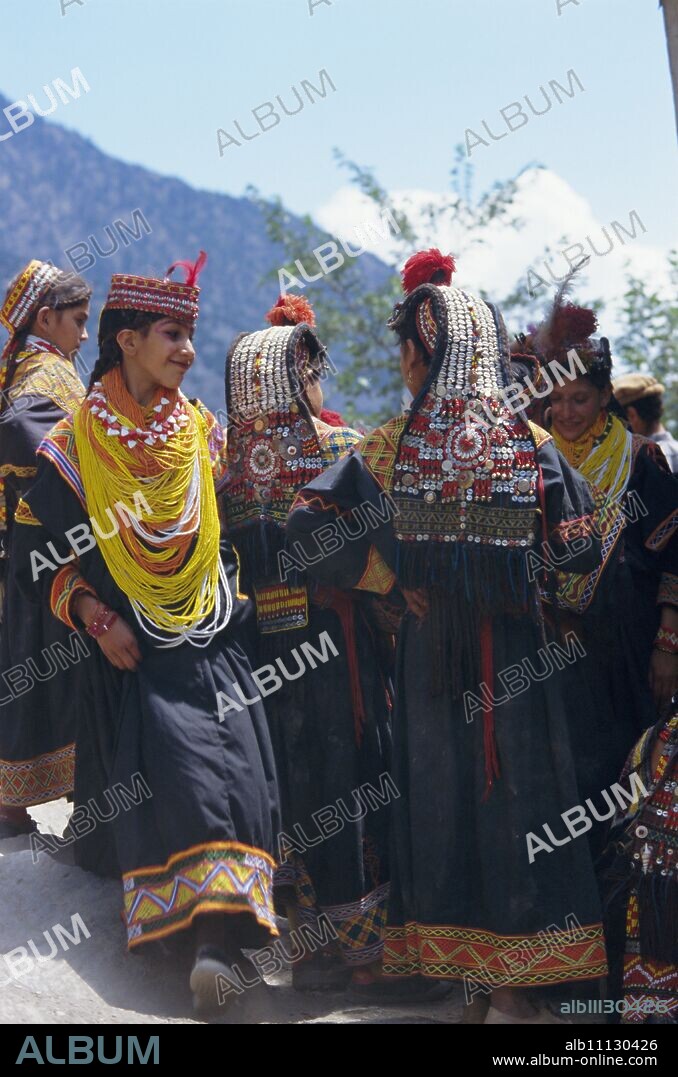 Group of Kalash women in traditional dress, Bumburet village, Chitral Valley, Pakistan, Asia.
