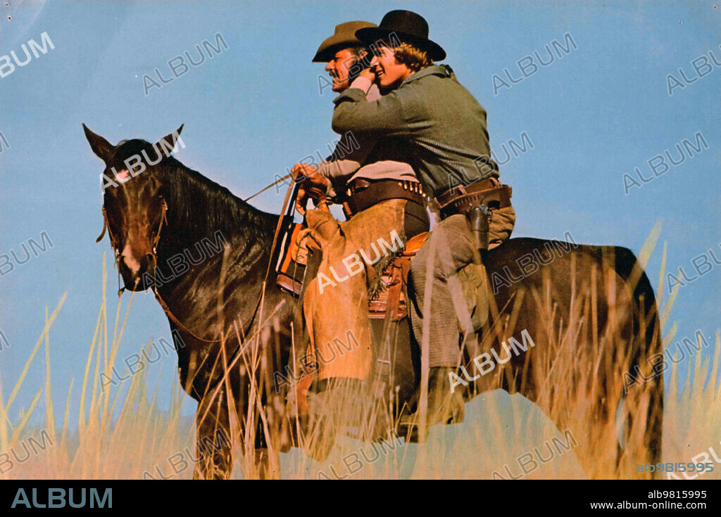 RYAN O'NEAL and WILLIAM HOLDEN in WILD ROVERS, 1971, directed by BLAKE EDWARDS. Copyright Metro-Goldwyn-Mayer (MGM).