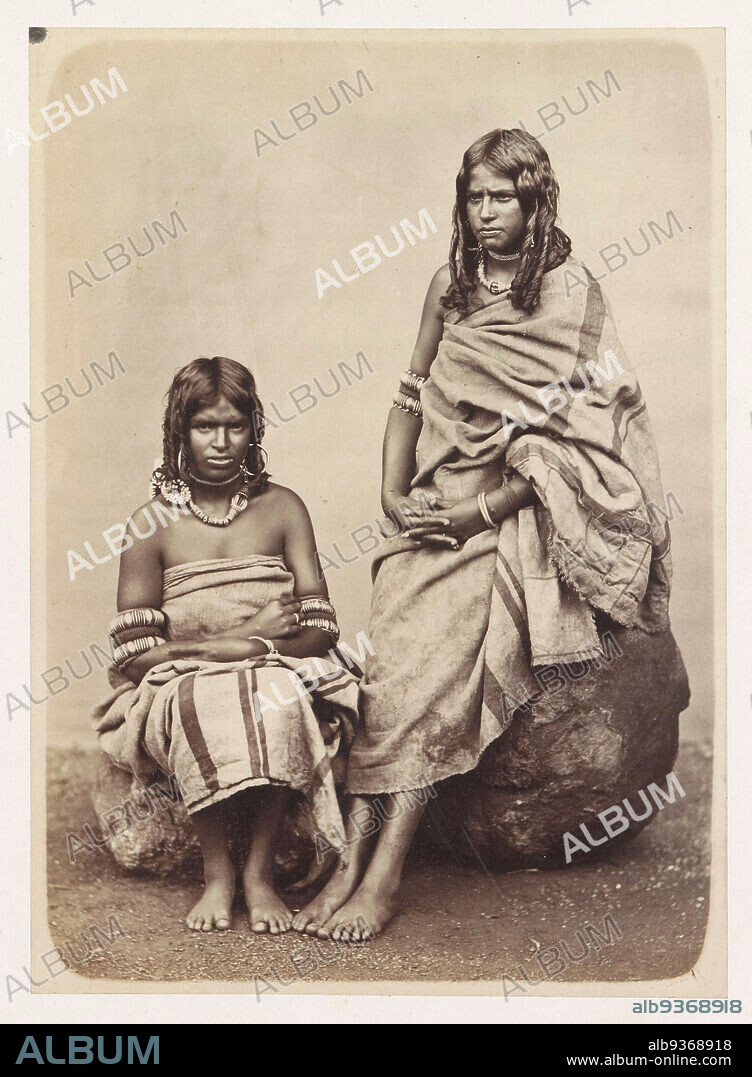 Studio portrait of two unknown Toda women from the Nilgiri Mountains, Aboriginal Tribes Neilcherry Hills (title on object), anonymous, Tamil Nadu, 1860 - 1890, paper, cardboard, albumen print, height 191 mm × width 138 mmheight 315 mm × width 443 mm.