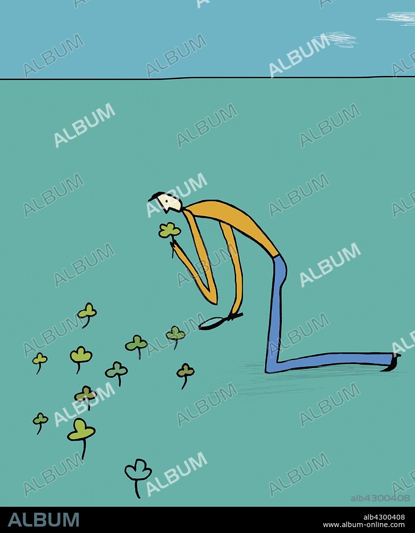Man picking four leaf clover.