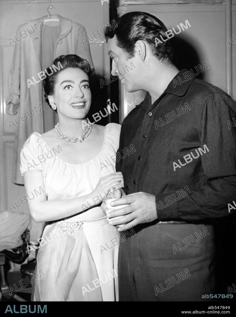 JOAN CRAWFORD and ROBERT TAYLOR in ALL THE BROTHERS WERE VALIANT, 1953, directed by RICHARD THORPE. Copyright M.G.M.