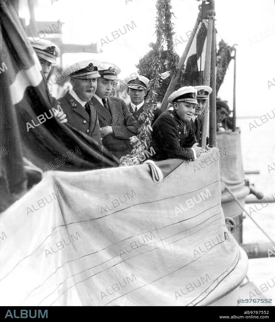 September 1922. Saint Sebastian. On the Battleship "Spain". Ss.Aa.Rr. the prince of Asturias (1) and the infant D. Jaime (2) on the deck of the "España" watching the guests arrive at the party organized by the officers of the Battleship.