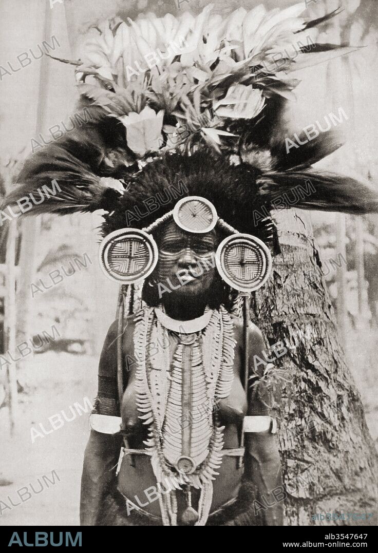 A woman of the Roro tribe from Papua New Guinea, Melanesia, decorated for a ceremonial dance. After a 19th century photograph. From Customs of The World, published c.1913.