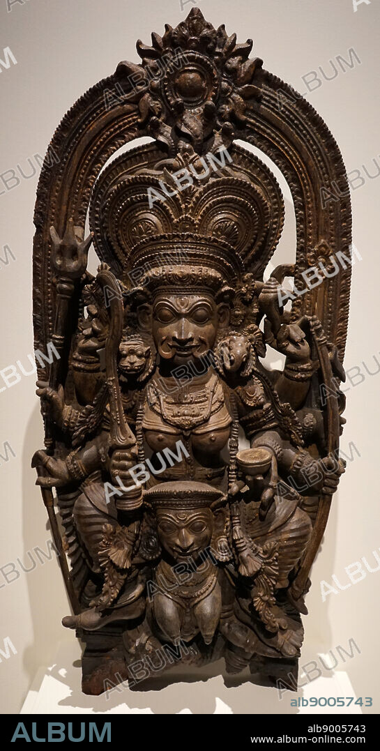 Statue relief, depicting the Hindu Goddess Kali standing over Chamunda (Chamundi), a fearsome aspect of Devi, the Hindu Divine Mother and one of the seven Matrikas (mother goddesses). 16th to 17th Century AD. From Kerala, India.