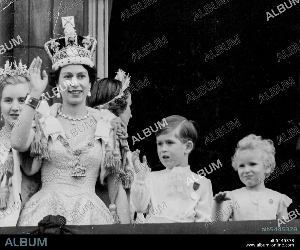 Crowned Queen And Her Children Wave From Palace Balcony -- Smiling and wearing the Imperial State Crown, the Queen is joined by her children, Prince Charles and Princess Anne, in waving from Buckingham Palace balcony to the cheering crowds in front of the Palace after the Coronation to-day (Tuesday). On left, behind the Queen, is Lady Anne Coke, one of the Queen's six maids of Honour at the Coronation. As the Queen, the Duke of Edinburgh and other members of the Royal Family appeared on the balcony, 168 jet fighters flew over in the Royal Air Force salute to the newly-crowned Sovereign. June 02, 1953.