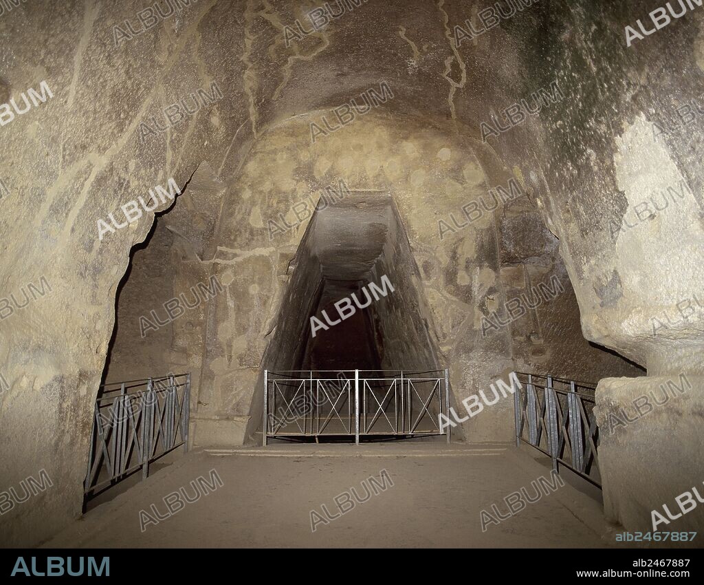 The Cave of the Cumaean Sibyl, a trapezoidal passage that leads to an innermost chamber where the Sibyl was thought to have prophesied. Dated at 4th-3th centuries B.C. Cumae. Italy.