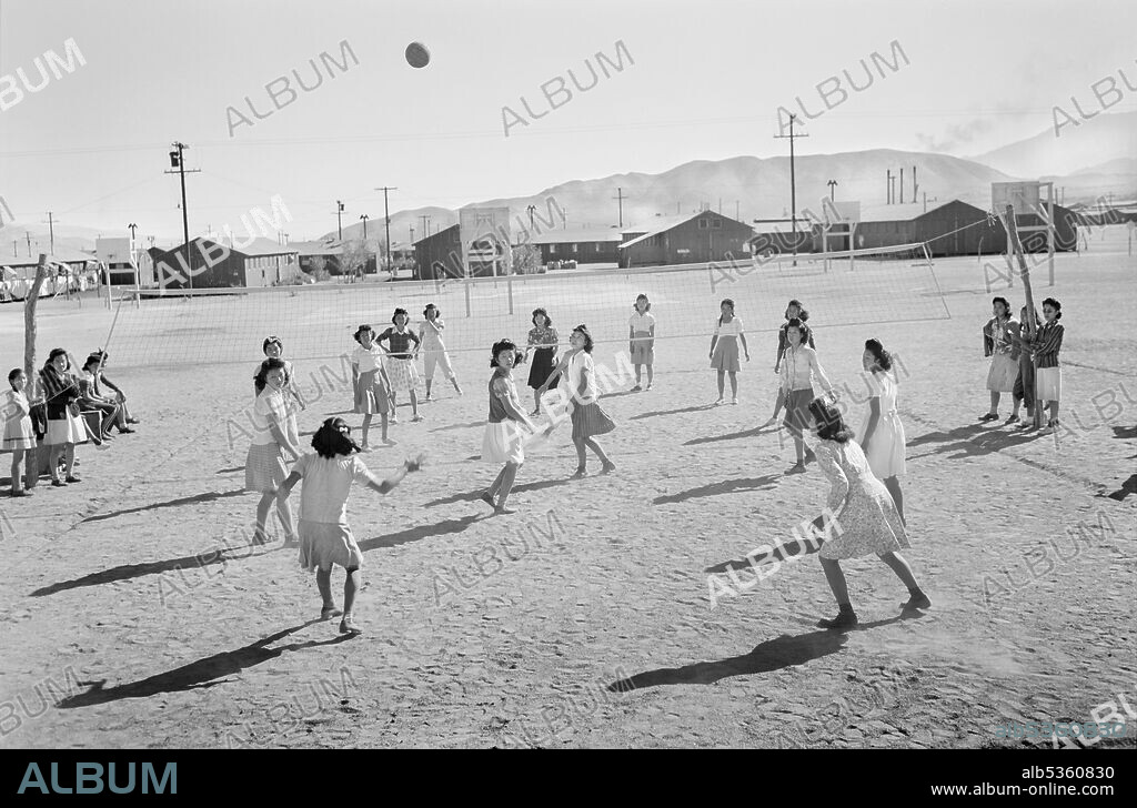 Japanese-American Girls playing Volleyball, Manzanar Relocation Center, California, USA, Ansel Adams, Manzanar War Relocation Center Collection, 1943.