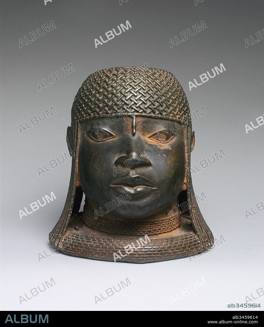 Head of an Oba, 16th century, Nigeria, Court of Benin, Edo peoples, Brass, H. 9 1/4 x W. 8 5/8 x D. 9 in. (23.5 x 21.9 x 22.9 cm), Metal-Sculpture, This commemorative cast-brass sculpture depicts the idealized likeness of an oba, or king, wearing a woven cap of coral beads, with lateral strands of coral suspended around both ears. A single bead extends from the headdress to the forehead, aligned with the ridge of the nose, creating bilateral symmetry.