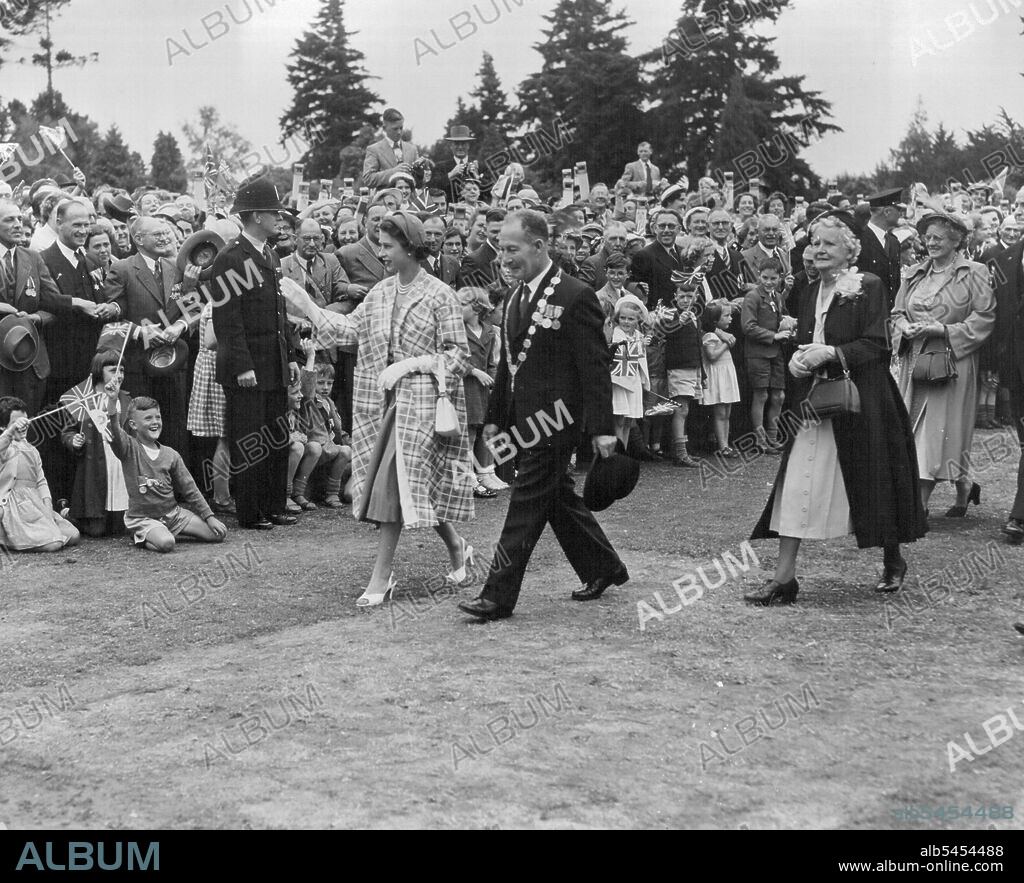 Queen Elizabeth with Mayor E. G. Coddington at a Civic Reception at Masterton, in the Wellington Province of New Zealand. After their visit to Masterton, the Royal Party left the North Island of the Dominion and flew to Blenheim, where the tour of the South Island begins. The Queen will leave New Zealand on 30th January, embarking on the Gothic at Fluff, for the trip to Sydney. January 20, 1954.