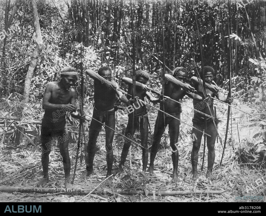Philippines:  c. 1890 Male members of the Negrito tribe showing their hunting skills   © Underwood Archives / The Image Works.
