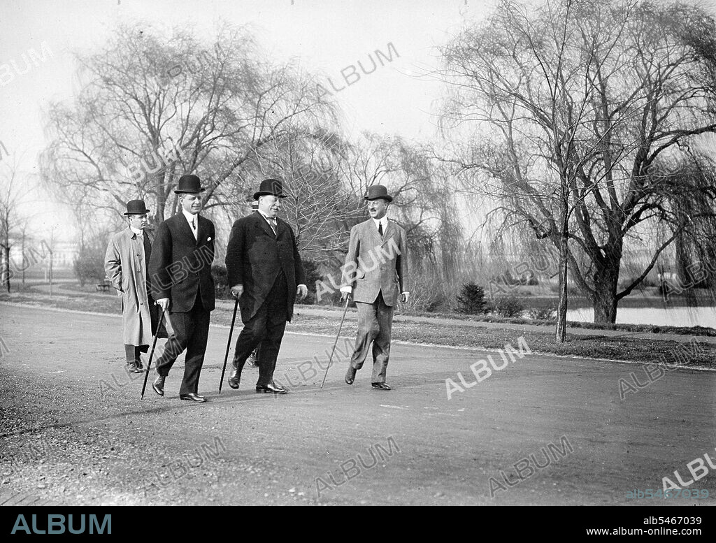President William Howard Taft walking with Archibald Butt and Charles Dewey Hilles circa 1910.
