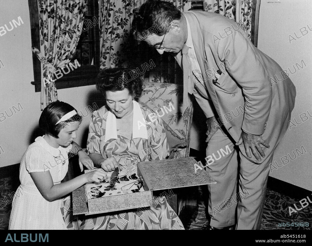 Professor and Mrs.  Schonell with their 11-year-old daughter, Eleanor. They believe in hobbies for all children as part of their education. Eleanor's is the collecting of butterfly specimens. February 25, 1953. (Photo by David R. Jones).
