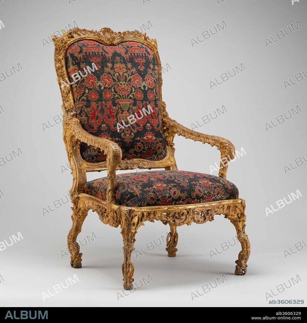 Armchair (fauteuil à la reine). Culture: French, Paris. Dimensions: H. 46-1/2 x W. 28 x D. 23-1/4 in.  (118.1 x 71.1 x 59.1 cm). Date: ca. 1690-1710.
In the most recent catalogue of the furniture at Versailles,[1] where two related armchairs à châssis (with drop-in seats) are on display in the refurbished bedroom of Louis XIV, this extraordinary chair model was described as "to be dated probably to the second quarter of the eighteenth century."[2] This proposed dating was based on "the setting back of the armrest supports" and "the absence of a stretcher" between the legs.[3] The chair's overall appearance, however, as well as the Italianate, trapezoidal form of the seat make an earlier date much more plausible. Also, the ornamentation and the minimally curved, rather straight-looking arms with their stylized-volute "hand knobs" betray the pervasive influence of Charles Le Brun (1619-1690), director of the royal manufactory at the Gobelins and of the Académie Royale de Peinture et de Sculpture (since 1663) under Louis XIV. Le Brun's playfully arranged designs are echoed in many decorative works of the late seventeenth century, for example, four embroidered wall hangings of about 1685 and an ingeniously designed side table of about 1690, both in the collection of the Museum.[4]
Another argument put forward in the Versailles catalogue for a date after Louis's death in 1715 is a perceived similarity between the burly, branchlike legs of this chair model and the pieds de biche, or legs turned three-quarters forward and terminating in a doe's foot that became popular for furniture during the early Régence period (see the entry for acc. no. 1982.60.83).[5] The fanciful, imaginative leg design of this chair model, based on a series of incurving segments (chantournés en dedans), is far more sophisticated than the pieds de biche. It is firmly rooted in the zoomorphic foot forms of the seventeenth century and can be visually documented in the Grand Galerie at Versailles as early as 1684.[6] If the present chair model is datable between 1690 and 1710, it is one of the first examples made with a drop-in upholstered seat.
A date of about 1690 to 1710 is especially attractive because it enables us to entertain the idea that the suite of seat furniture to which this chair belongs recreated in gilded wood the silver furniture at Versailles that was melted down in 1689 to pay for the king's military campaigns.[7] This idea is supported by the simulated drapery ornamentation on the armrests. This so-called lambrequin motif (see the entry for acc. no. 69.292.1) is rarely found in contemporary French woodwork but is fairly common in the products of the court goldsmiths. Laurence Buffet-Challié observed of another example of this model, in the Lopez-Willshaw collection in Paris, that "the woodwork of this armchair [of] c. 1700 is carved almost as if it were the work of a goldsmith. The curved frame to the back and the seat, and the absence of stretchers anticipate the style of the eighteenth century."[8]
A recent discovery in a French publication of 1837 may offer a key to settling all these arguments. In his Moyen-Âge pittoresque: Monumens d'architecture, meubles et décors Philippe Moret published a lithograph of this chair model. The short caption gives no medium, dimensions, or other details about it, but the description reads, "Armchair used as King Stanislas's throne," and a provenance is given: "from the collection of M. Schwiter."[9] The king referred to must be the Polish prince Stanislas Leszczynski (1677-1766), who was elected king of Poland in 1704 and displaced in 1709 by Augustus the Strong of Saxony (1670-1733). In 1725 his fortunes rose again, when his daughter Maria was married to Louis XV (1710-1774). As the French king's father-in-law, Leszczynski was made duke of Lorraine and took up residence in Nancy, transforming that town into a major cultural center of the Rococo period.[10] The splendor-loving Leszczynski  regularly received furnishings and luxury goods from the French court as gifts, and the opulent chair seen in the lithograph, the Museum's example, and other pieces of the suite may have been among them. By Leszczynski's time the style was certainly out of fashion, but their royal pedigree, flamboyant opulence, and highly unusual appearance must have been as fascinating then as they are today. At some point, the suite was broken up and scattered. We do not know if the armchair in the Schwiter collection was a wooden example (which, by the way it is characterized, seems likely) or if it was a silver version that had escaped the mint.[11] It was, however, called a throne, indicating not only a royal association but also that in 1837 only a single example was known. We remain in the dark as regards the Schwiter collection. A Louis-August Schwiter (1808-1889), later Baron Schwiter, is recorded in a portrait by Eugène Delacroix (1798-1863), today in the National Gallery, London (NG 3286). In his inventory of public-sale catalogues, Frits Lugt (1884-1970) mentions that a collector named Schwiter sold works of art at a series of auctions in Paris between 11-12 December 1863 and 16-17 December 1864 and that some of the lots included furniture.[12]
[Wolfram Koeppe 2006]
Footnotes:
[1] Pierre Arizzoli-Clémentel. Versailles: Furniture of the Royal Palace, Seventeenth and Eighteenth Centuries. Vol. 2. Dijon, 2002, pp. 178-79, no. 59.
[2] Ibid., p. 178. See also Daniel Meyer. "La restitution de la chambre de Louis XIV à Versailles." La revue du Louvre et des musées de France, 1980, p. 246.
[3] Pierre Arizzoli-Clémentel. Versailles: Furniture of the Royal Palace, Seventeenth and Eighteenth Centuries. Vol. 2. Dijon, 2002, pp. 178-79, no. 59.
[4] On the wall hangings, see Alice M. Zrebiec in Olga Raggio, James Parker, Clare Le Corbeiller, Jessie McNab, Clare Vincent, and Alice M. Zrebiac. "French Decorative Arts during the Reign of Louis XIV, 1654-1715." The Metropolitan Museum of Art Bulletin 46, no. 4 (Spring 1989), p. 32 and color ills. pp. 10-11. On the side table, which is based on designs by Le Brun, see James Parker in Olga Raggio, op. cit., pp. 22-23 and p. 3, fig. 4.
[5] Pierre Arizzoli-Clémentel. Versailles: Furniture of the Royal Palace, Seventeenth and Eighteenth Centuries. Vol. 2. Dijon, 200, p. 178 (but the proposed interpretation of the pied de biche is not sound); and Wolfram Koeppe. "Möbel und Schaustücke." In Liselotte von der Pfalz: Madame am Hofe des Sonnenkönigs, ed. Sigrun Paas, pp. 179-88. Exh. cat., Heidelberger Schloss. Heidelberg, 1996, p. 185, fig. 5.
[6] The chair's branchlike legs are unusual in the same way as are the animal legs of the side tables in the Grand Galerie seen in an etching of 1684 by Sébastien Le Clerc (1637-1714) in Olga Raggio, James Parker, Clare Le Corbeiller, Jessie McNab, Clare Vincent, and Alice M. Zrebiac. "French Decorative Arts during the Reign of Louis XIV, 1654-1715." The Metropolitan Museum of Art Bulletin 46, no. 4 (Spring 1989), p. 6, fig. 7.
[7] Georges S. Salmann. "A Great Art Lover: The Late Arturo Lopez-Willshaw." Connoisseur 151 (October 1962), p. 74, fig. 6; and Nietta Aprà. The Louis Styles: Louis XIV, Louis XV, Louis XVI. London, 1972, p. 26, fig. 17.
[8] Laurence Buffet-Challié. "The Seventeenth Century: France." In World Fruniture: An Illustrated History, ed. Helena Hayward, pp. 76-85. New York, 1965, p. 84, figs. 278, 279.
[9] "Fauteuil ayant servi de Trône au Roi Stanislas"; Philippe Moret. Moyen-Âge pittoresque: Monumens d'architecture, meubles et décors du Xe au XVIIe siècle. 5 vols. Paris, 1837-40, vol. 1, pl. 18. There is a copy of this book in the Thomas J. Watson Library, Metropolitan Museum.
[10] Stanislas: Un roi de Pologne en Lorraine. Exh. cat., Musée Historique Lorrain, Nancy. Versailles, 2004.
[11] I hope that this rather speculative entry will encourage scholars to investigate the archives at Nancy and in Stanislas's residences and that their research will shed light on the mystery of these important chairs.
[12] I am most grateful to Florian Knothe, Annette Kade Art History Fellow, 2005-2006, Metropolitan Museum, for sharing with me the fruits of his research on Schwiter.