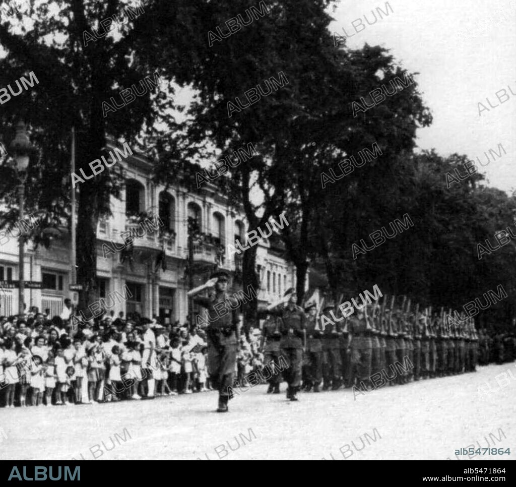 In September 1945, 20,000 British troops of the 20th Indian Division occupied Saigon under the command of General Sir Douglas David Gracey. During the Potsdam Conference in July 1945, the Allies had agreed on Britain taking control of Vietnam south of the 16th parallel (then part of French Indochina) from the Japanese occupiers. Meanwhile, Ho Chi Minh proclaimed Vietnamese independence from French rule and major pro-independence and anti-French demonstrations were held in Saigon. Ho Chi Minh was the leader of the communist Viet Minh. The French, anxious to retain their colony, persuaded Gracey's Commander in Chief, Lord Mountbatten, to authorise Gracey to declare martial law. Fearing a communist takeover of Vietnam, Gracey decided to rearm French citizens who had remained in Saigon. He allowed them to seize control of public buildings from the Viet Minh. In October 1945, as fighting spread throughout the city, Gracey issued guns to the Japanese troops who had surrendered. He used them to help maintain colonial rule. According to some socialist and communist commentaries, this controversial decision furthered Ho Ch Minh's cause of liberating Vietnam from foreigners' rule and precipitated the First Indochina War. French General Leclerc arrived in Saigon in October 1945 to assume authority but it was not until well into the first half of 1946 that enough French troops had arrived to allow General Gracey to return with his troops to India where the 20th Indian Division was disbanded.