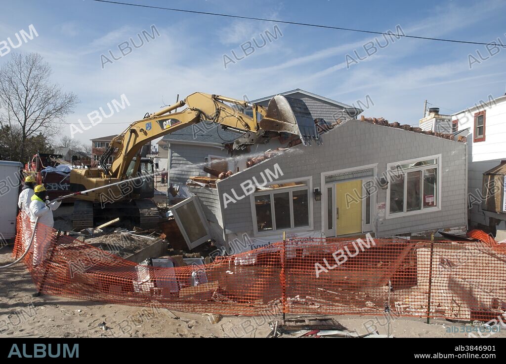 Hurricane Sandy Aftermath. Demolition of damaged house. Breezy Pt. Queens, NY.