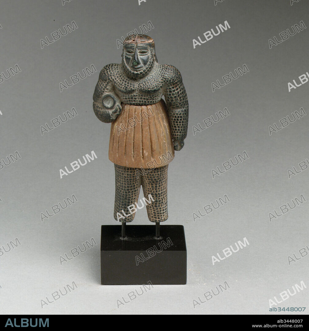 Monstrous male figure, Bronze Age, ca. late 3rd–early 2nd millennium B.C., Bactria-Margiana or eastern Iran, Bactria-Margiana Archaeological Complex, Chlorite, calcite, gold, iron, H. 4 in. (10.1 cm), Stone-Sculpture, In the world of the ancient Near East, images and beings that combined human and animal qualities were thought to possess supernatural powers. This small yet potent figure, with its human face and serpentine-scaled body, probably represents such a creature, enlivened and charged with magical efficacy whether propitious or demonic.