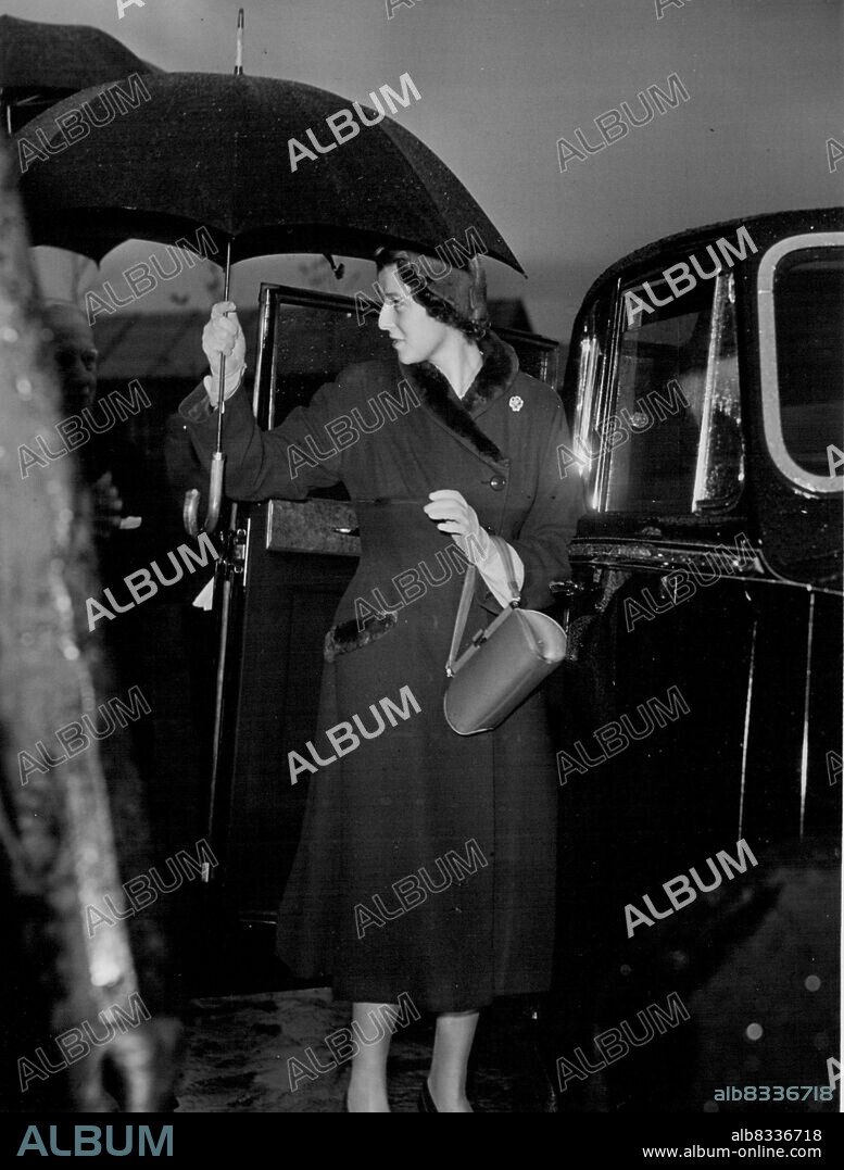 First Official Tour For Prince's Alexandra - 16 year old Princess Alexandra of Kent went on her first official tour yesterday a trip to Lancashire's cotton belt. Her mother, the Duchess of Kent went with her. The day began with a visit to the Mayalan Teachers training College at Kirby, near Liverpool. As the Princess was leaving the college she handed back to one of her escorts the umbrella loaned to her for the inspection. October 13, 1953. (Photo by Daily Express Picture).