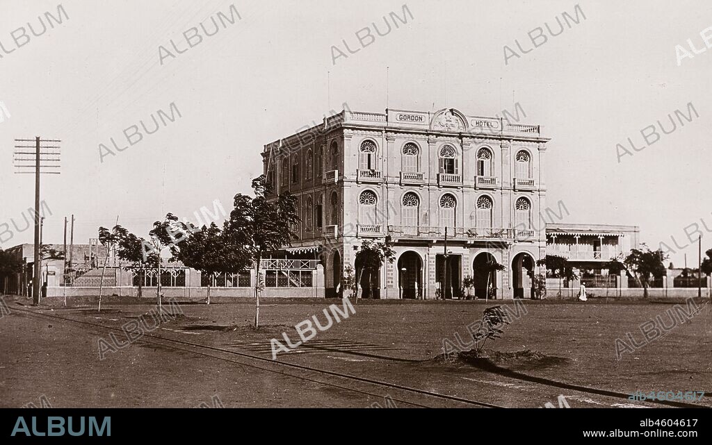 Sudan, Printed caption reads: 'The Gordon Hotel Khartoum. Published by G N Morhig, The English Pharmacy, Khartoum. Copyright 210'. Exterior view of the façade of the Gordon Hotel in Khartoum. The grand, colonial-style, three-storey building was named in honour of General Charles Gordon (1833-1885), [c.1906]. 2003/222/1/1/29.
