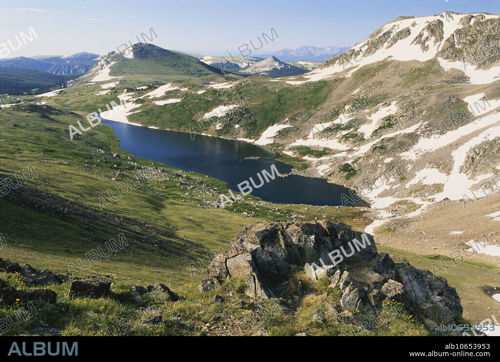 Pink granite and a paternoster lake in Beartooth Pass in the Absaroka Mountains, Shoshone National Forest, Wyoming. Paternoster lakes (so called for their resemblance to a string of prayer beads) are a series of lakes in a glacially-eroded valley.