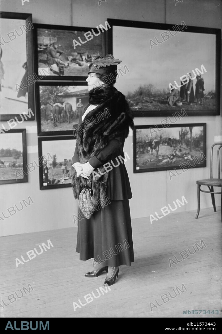 BAIN NEWS SERVICE. Marie Josephine Manice Mercati, 1918. Shows Mrs. Newbold Le Roy Edgar, formerly Marie or Mary Josephine Manice. She is possibly at the International Flower Show at the Grand Central Palace, New York City. Photographs in background may be part of an exhibit of Serbian war photographs taken during World War I.