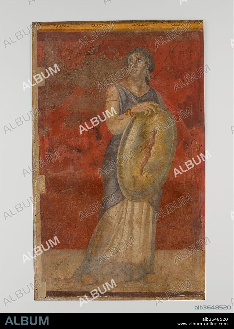 Wall painting from Room H of the Villa of P. Fannius Synistor at Boscoreale. Culture: Roman. Dimensions: Overall: 70 x 40 1/4in. (177.8 x 102.2cm). Date: ca. 50-40 B.C..
Standing woman holding a shield: from the grand triclinium. She is probably a seer predicting the birth of a male heir and future king. The image of a nude man wearing the white band that served as crown for Hellenistic rulers appears as a reflection in her shield.
