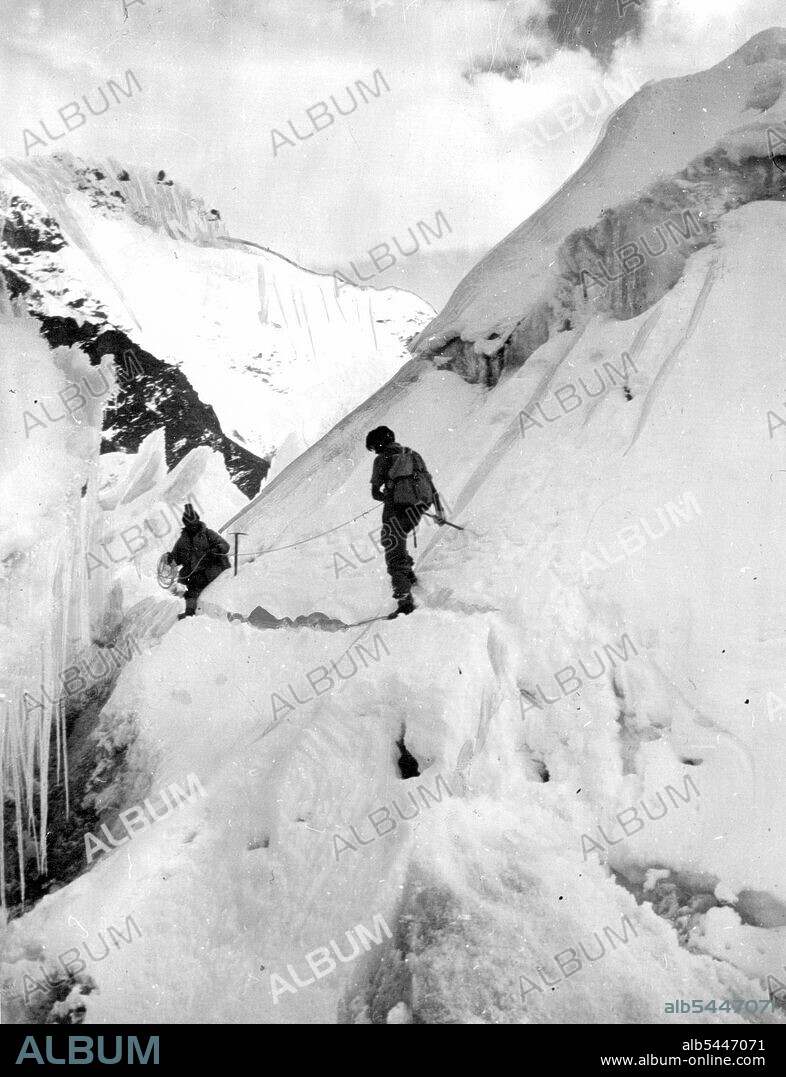 Dr. Ward and Dannu on Nup La Ice-Fall. Dr. Michael Ward, a lieutenant in the Guards, and another member of the British Everest expedition on an ice-fall at the approaches to the mountain. In the last 30 years, a score of men have died during explorations of the 29,000ft pinnacle. December 27, 1951.