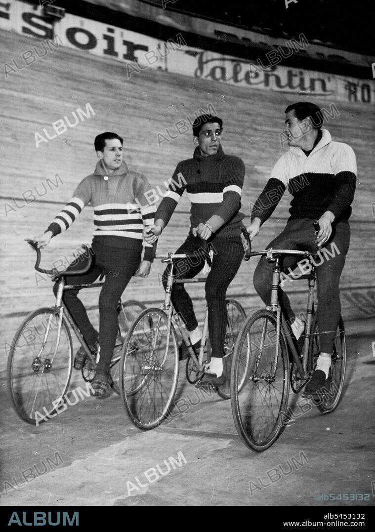 Six-Day Cycle Race In Paris -- Left to Right ; Alfred Strom of Australia; Gerit Peters of Haarlem, Holland, and Armin Von Buren of Zurich, Switzerland, make a leisurely turn around the Velodrome D'hiver, Mar. 18 in the six day cycle race in Paris, France.Australian cyclist Alf Strom (left) takes a leisurely turn around the Velodrome D'hiver during the recent six-day in Paris. Strom's companions are Gerit Peters (Holland) and Armin von Buren (Switzerland). March 20, 1950. (Photo by Associated Press Photo).