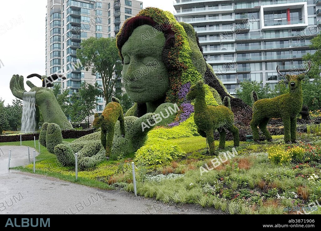 Plant sculpture Mother Earth with modern buildings behind, Mosaicanada Exhibition, Gatineau, Quebec Province, Canada, North America.