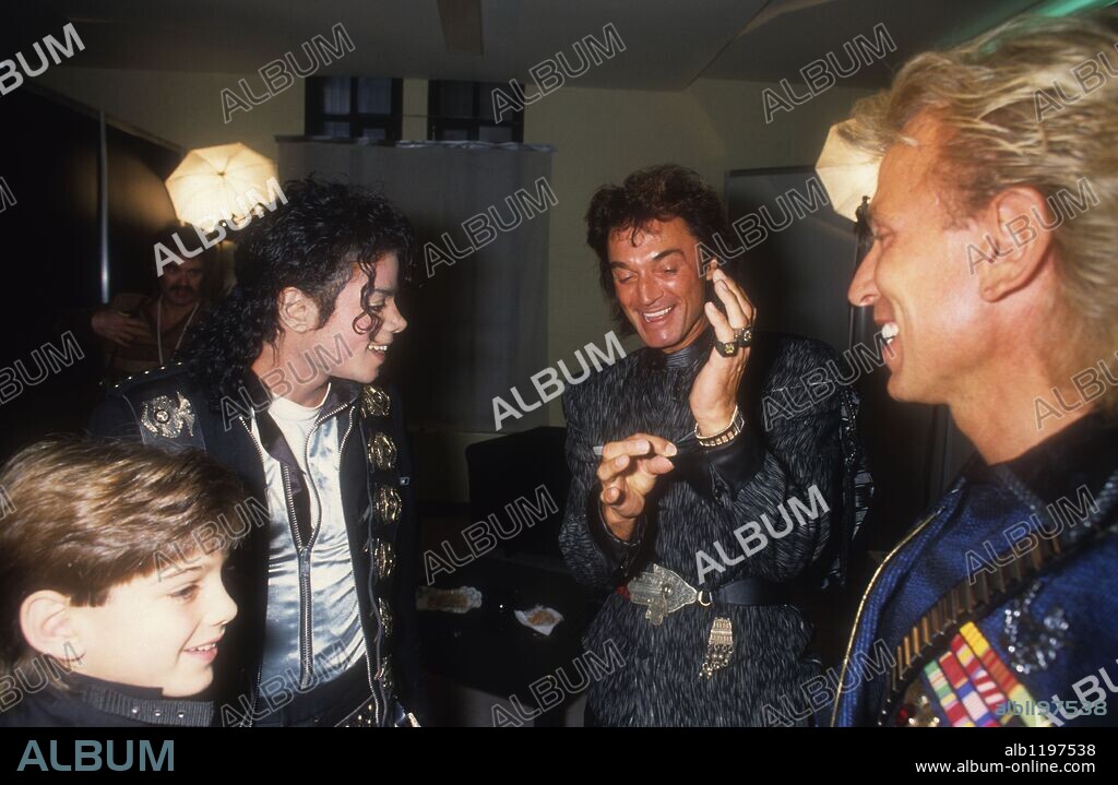 MICHAEL JACKSON, roy and Siegfried. Jul 04, 1988 - Cologne, Germany - Michael Joseph Jackson (Aug. 29, 1958 - Jun. 25, 2009) 50, American recording artist superstar, entertainer, and businessman - the 'King of Pop.' Debuted on the professional music scene at 11 as a member of The Jackson 5. Solo in 1971 - with five albums the world's best-selling records. Jacko's MTV videos were legendary. PICTURED: 1988 at Phantasialand with Vegas magicians SIEGFRIED and ROY and Pepsi boy spokesperson while on The Bad World Tour which was the first solo world concert tour by Jackson, covering Japan, Australia, United States and Europe from 1987 to 1989. The tour, sponsored by Pepsi included 123 concerts to 4.4 million fans across 15 countries. When the tour concluded it grossed a total of $125 million, adding two new entries in the Guinness Book of World Records for the largest grossing tour in history. 04/07/1988