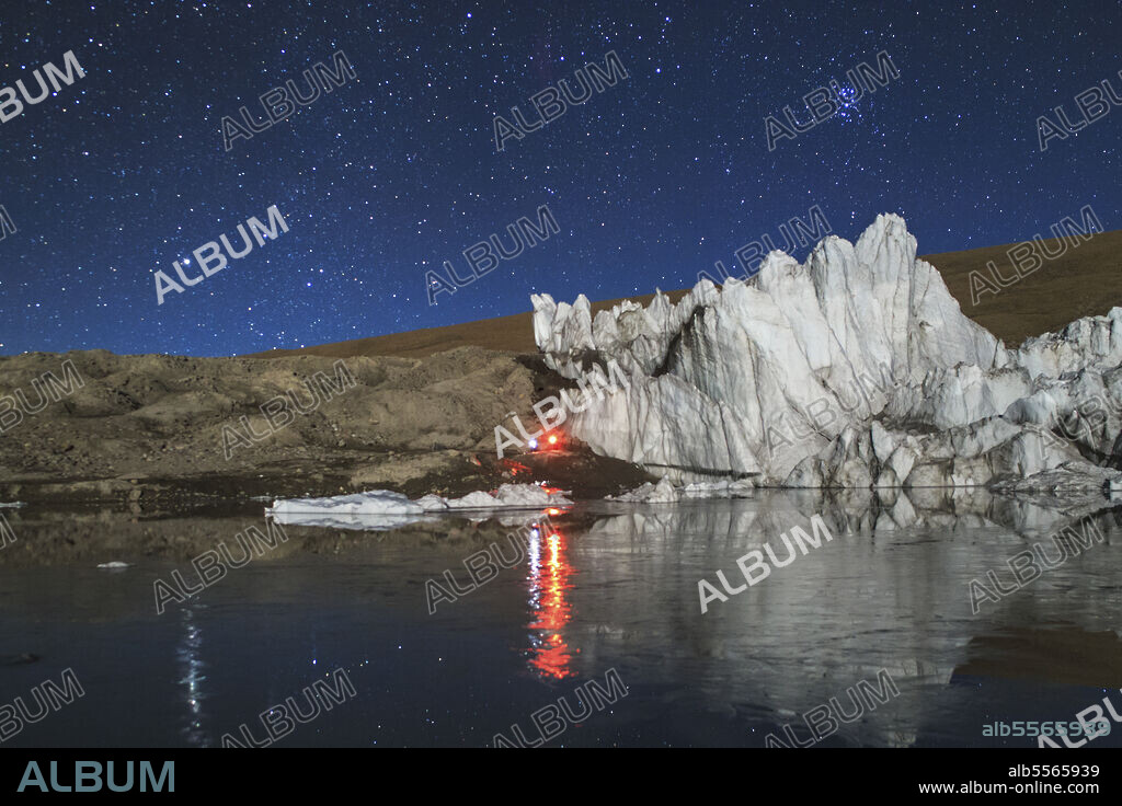 The night sky above a glacier in the Himalayas of Tibet, on the border of China and Bhutan.