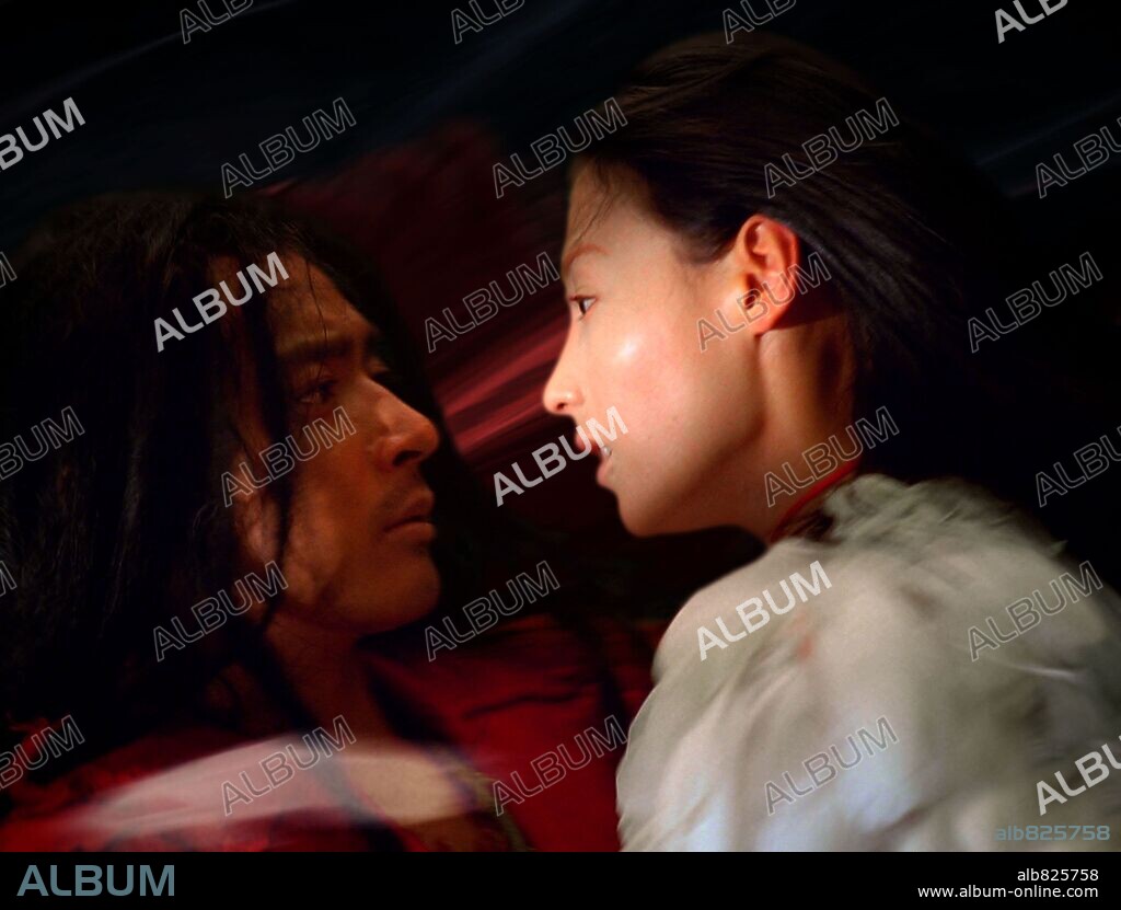 CECILIA CHEUNG and JANG DONG-KUN in THE PROMISE, 2005 (WU JI), directed by CHEN KAIGE. Copyright WARNER INDEPENDENT PICTURES.