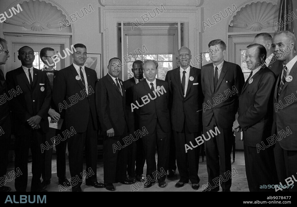Civil rights leaders meet with President John F. Kennedy in the oval office of the White House after the March on Washington; D.C. Photograph shows (left to right): Willard Wirtz (Secretary of Labour); Floyd McKissick (CORE); Mathew Ahmann (National Catholic Conference for Interracial Justice); Whitney Young (National Urban League); Martin Luther King; Jr.(SCLC); John Lewis (SNCC); Rabbi Joachim Prinz (American Jewish Congress); A. Philip Randolph; with Reverend Eugene Carson Blake partially visible behind him; President John F. Kennedy; Walter Reuther (labour leader); with Vice President Lyndon Johnson partially visible behind him.