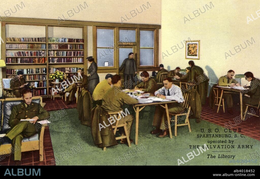 USO Club, Spartanburg, South Carolina, USA, 1943. Postcard. Interior view of the library of the USO Club, operated by the Salvation Army. Soldiers are sitting in chairs and at tables reading. The United Service Organisations (USO) were founded in 1941 by President Franklin D Roosevelt to provide recreational and morale-boosting services for US military personnel.