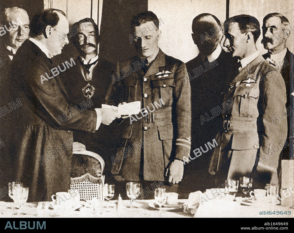 John William Alcock (1892-1919) and Arthur Whitten Brown (1886-1948) British aviators. First men to fly Atlantic non-stop, 14 June 1919. Presented with a£10,000 prize by Winston Churchill.