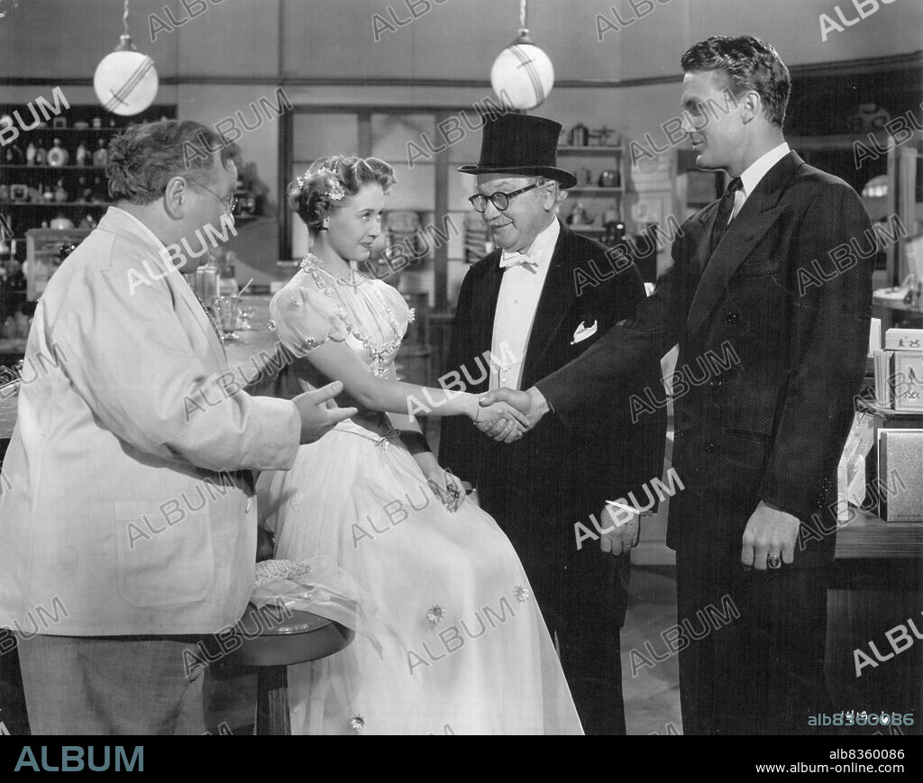 Make A Date With Judy For Fun, Romance And Music... Metro Goldwyn-Mayer's Technicolor musical comedy starring Wallace Beery, Jane Powell, Elizabeth Taylor, Carmen Miranda, Robert Stack, Scotty Beckett and Xavier Cugat, is the story of two girls, their dates, their families, their troubles, their fun, and their romances. it was directed by Richard Thorpe, produced by Joe Pasternak, and slanted for the entire family. But she hadn't counted on "Gramps" (George Cleveland). Camps puts on top hat and tails and decides to take Janie himself. But her friend the drugstore owner (Lloyd Corrigan) presents his Nephew Robert Stack. One look at Bob and Janie decides her troubles are over. Judy is furious at having no escort for the school dance. Her grandfather (George Cleveland) is taking her, when they stop off at the drugstone and meet Stephen Andrews (Robert Stack). October 27, 1948.