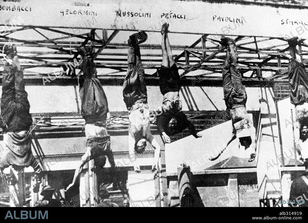 The corpses of Mussolini, his Mistress Clara Petacci and other fascist associates, hanging by their feet in the Piazzale Loreto (Milan) after being shot by communist partisans the 28th April 1945. From left to right: Bombacci, Gelormini and Mussolini.