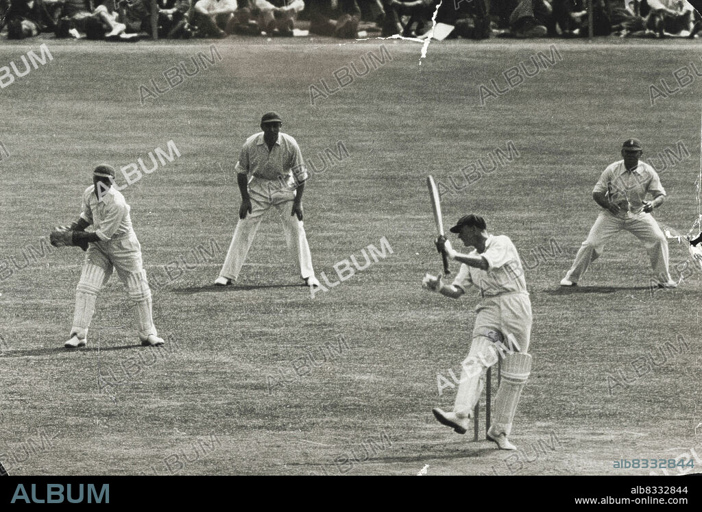 A scene from a Test in 1934. O'Reilly swinging at a bumper from Gubby Allen - and missing. July 10, 1934.