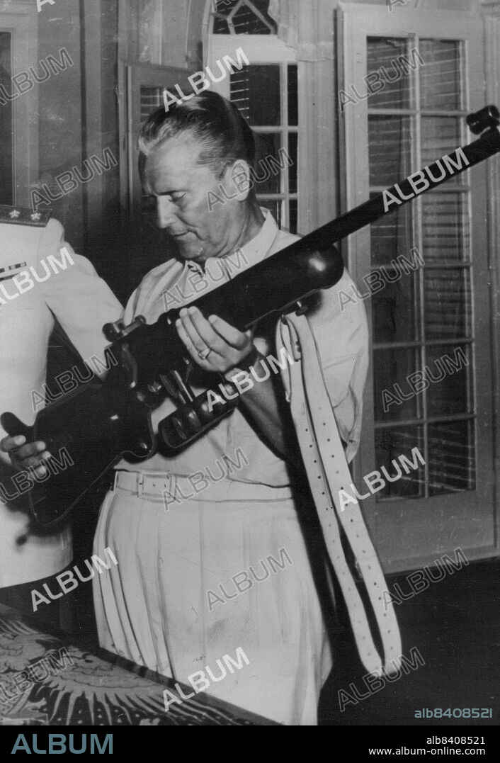 Gunning For Someone...... -- Yugoslav dictator Tito fondly inspects a marksman's gun during a visit to the Adriatic Island of Brioni recently. Tito, whose particular brand of communism has ***** with Kremlin disapproval, has been reported to surrounded by a personal. bodyguard whose job is to foil any assassination attempt - but a determined Marshal and this monster gun should deter all those with suicidal ideas. September 07, 1949.