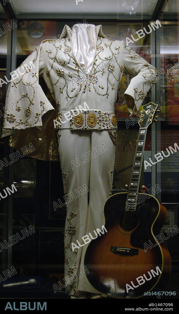 Tennessee. Memphis. Graceland Mansion to Elvis Presley (1935-1977). Inside. Suit and guitar. USA.
