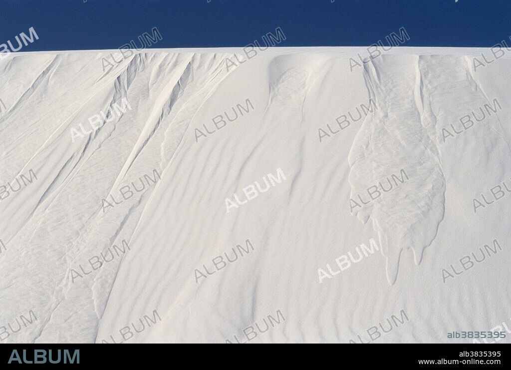 Avalanche paths on the slipface of a sand dune in White Sands National Monument, New Mexico, show where so much sand built up that a large slab eventually slid down the slope.