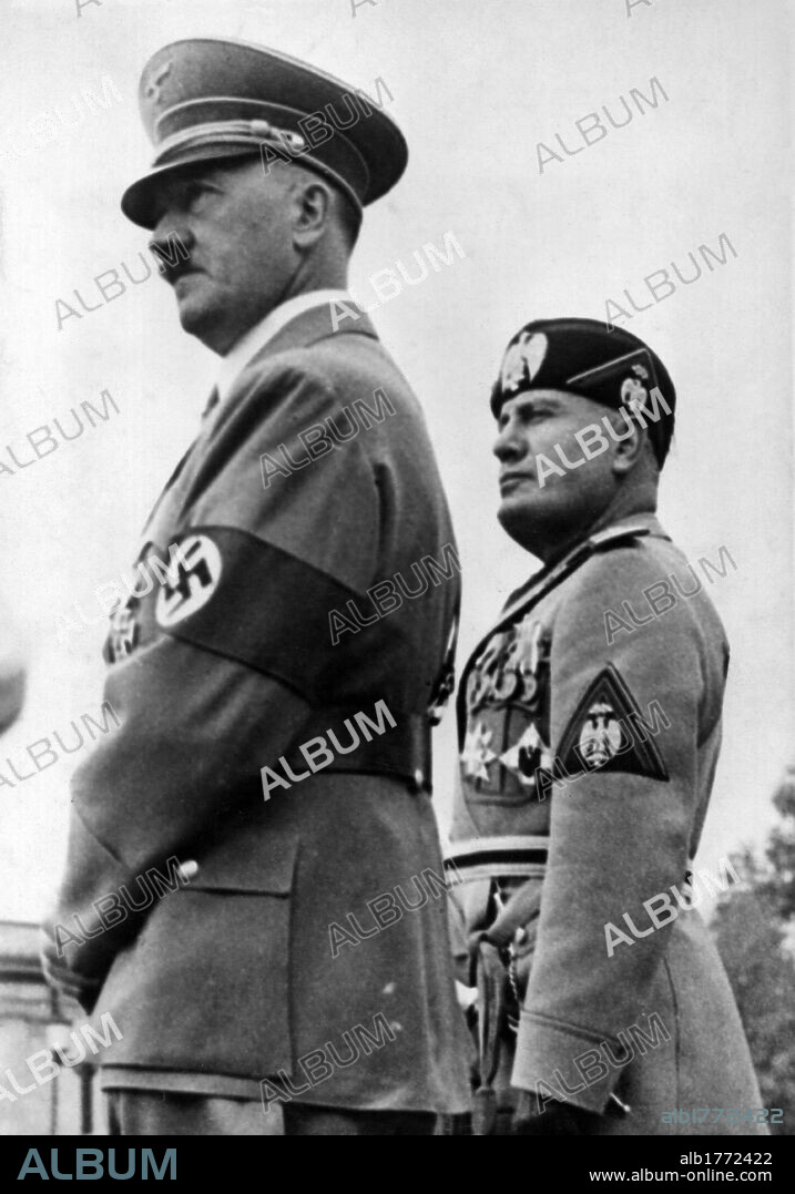 Mussolini and Adolf Hitler attending a parade in Munich. The head of the government of the Kingdom of Italy of Benito Mussolini and the Chancellor of the Third Reich Adolf Hitler attending a parade of the German armed forces. Munich, 25th September 1937.