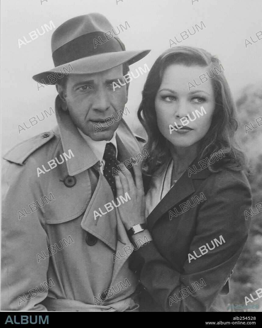 MICHELLE PHILLIPS and ROBERT SACCHI in THE MAN WITH BOGART'S FACE, 1980, directed by ROBERT DAY. Copyright SIMON FILM PRODUCTIONS.