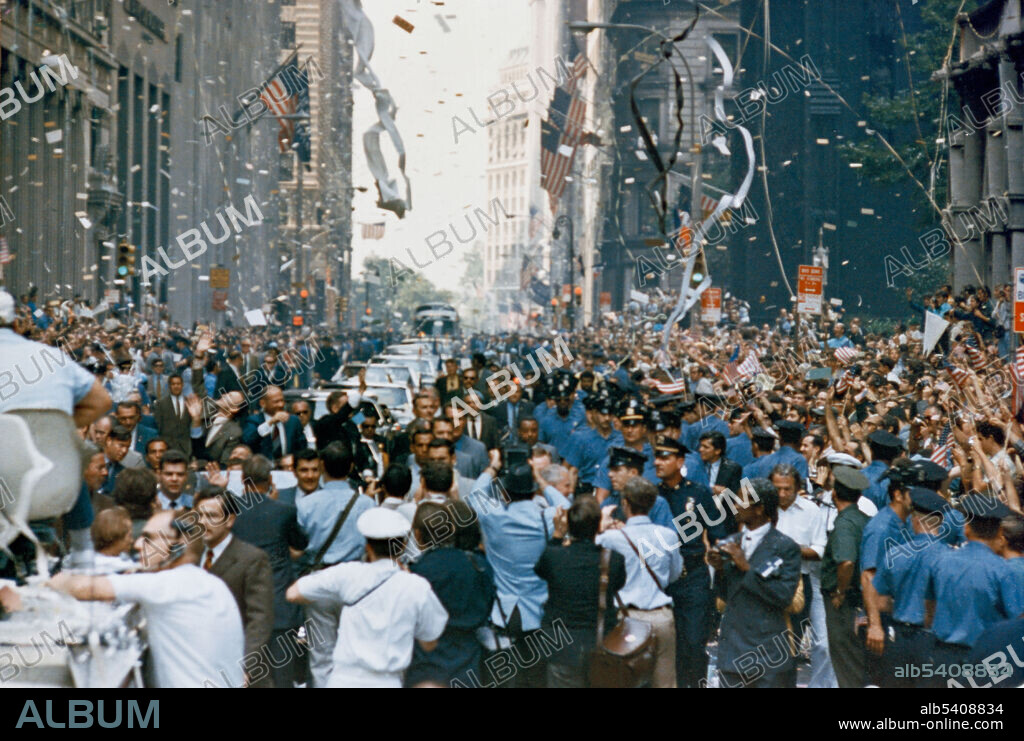 New York City welcomes Apollo 11 crewmen in a showering of ticker tape down Broadway and Park Avenue in a parade termed as the largest in the city's history. Pictured in the lead car, from the right, are astronauts Neil A. Armstrong, commander; Michael Collins, command module pilot; and Edwin E. Aldrin Jr., lunar module pilot. Apollo 11 was the spaceflight that landed the first two people on the Moon. Commander Neil Armstrong and lunar module pilot Buzz Aldrin landed the Apollo Lunar Module Eagle on July 20, 1969, at 20:17 UTC. Armstrong became the first person to step onto the lunar surface six hours later on July 21 at 02:56:15 UTC; Aldrin joined him 19 minutes later. They spent about two and a quarter hours together outside the spacecraft, and collected 47.5 pounds of lunar material to bring back to Earth. Command module pilot Michael Collins flew the command module Columbia alone in lunar orbit while they were on the Moon's surface. Armstrong and Aldrin spent 21.5 hours on the lunar surface before rejoining Columbia in lunar orbit.