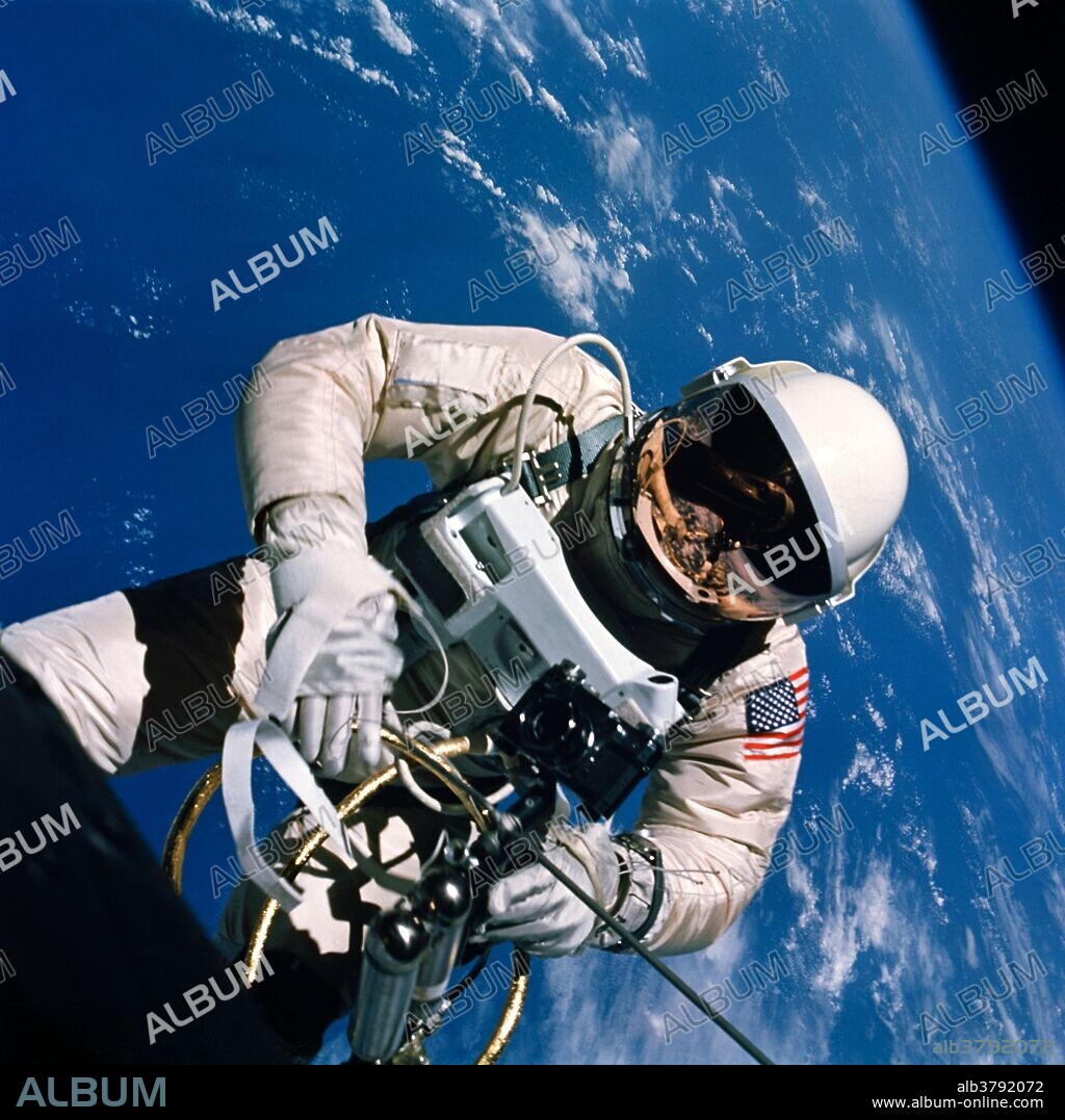 Astronaut Edward H. White II, pilot of the Gemini IV four day Earth-orbital mission, floats in the zero gravity of space outside the Gemini IV spacecraft. Behind him is the brilliant blue Earth and its white cloud cover. White wears a specially designed spacesuit; and the visor of the helmet is gold plated to protect him against the unfiltered rays of the sun. He wears an emergency oxygen pack, also. He is secured to the spacecraft by a 25 feet umbilical line and a 23 feet tether line, both wrapped in gold tape to form one cord. In his left hand is a Hand-Held Self-Maneuvering Unit (HHSMU) with which he controls his movements in space. Astronaut James A. McDivitt, command pilot of the.