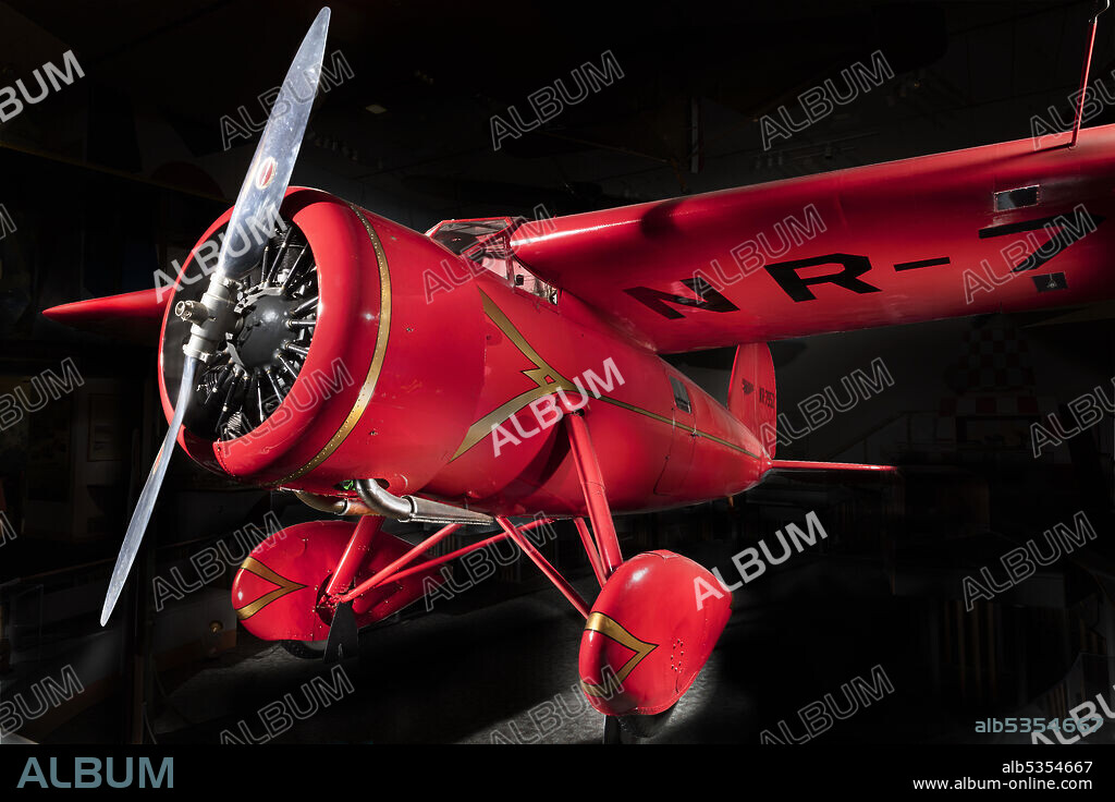 LOCKHEED AIRCRAFT CORPORATION. NR7952. High-speed cabin monoplane with cantilever wings and streamlined design. On May 20-21, 1932, Amelia Earhart flew this Vega across the Atlantic Ocean becoming the first woman to fly, and only the second person to solo, the Atlantic. Vegas were highly prized as racing and record-setting aircraft, and as seven-place airliners. Amelia Earhart set two of her many aviation records in this bright red Lockheed 5B Vega. In 1932 she flew it alone across the Atlantic Ocean, then flew it nonstop across the United States-both firsts for a woman. Introduced in 1927, the Vega was the first product of designer Jack Northrop and Allan Loughead's Lockheed Aircraft Company.