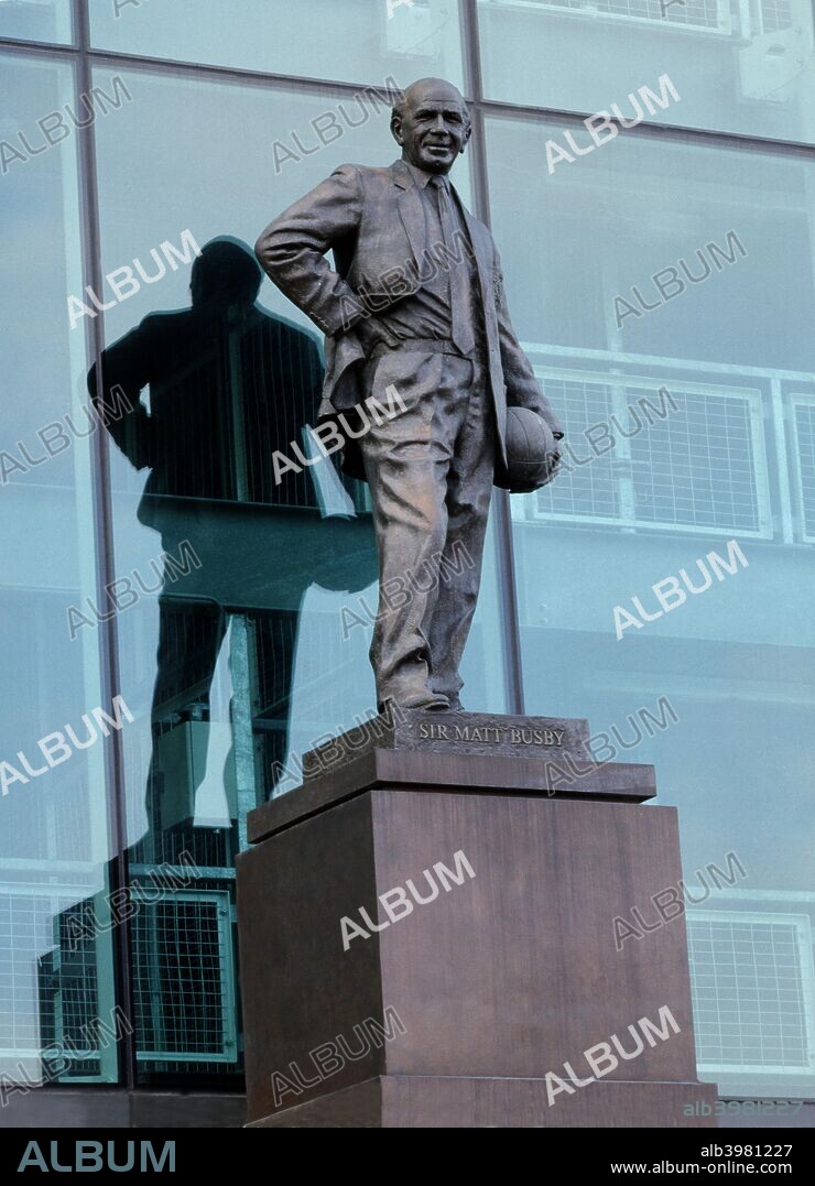 Statue of Sir Matt Busby outside Old Trafford football stadium, Manchester, c2000s. View of the statue of the club's famous former manager on Sir Matt Busby Way.