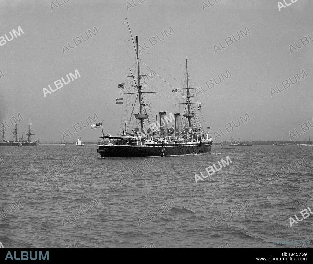 Glass negative 1900,Victorian era. British cruiser HMS Juno at Spithead review 1902. HMS Juno was an Eclipse-class protected cruiser built for the Royal Navy in the mid-1890s.Juno was assigned to the 11th Cruiser Squadron operating from Ireland. In 1901, .