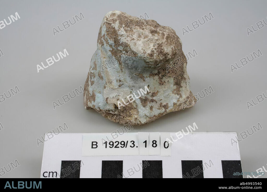 A fragment of a figurine (?), Very weathered and without recognizable shape., Figurine (?), Stone, limestone, faience (?), L 8 cm, W 7 cm, H 6.5 cm, Palestine.