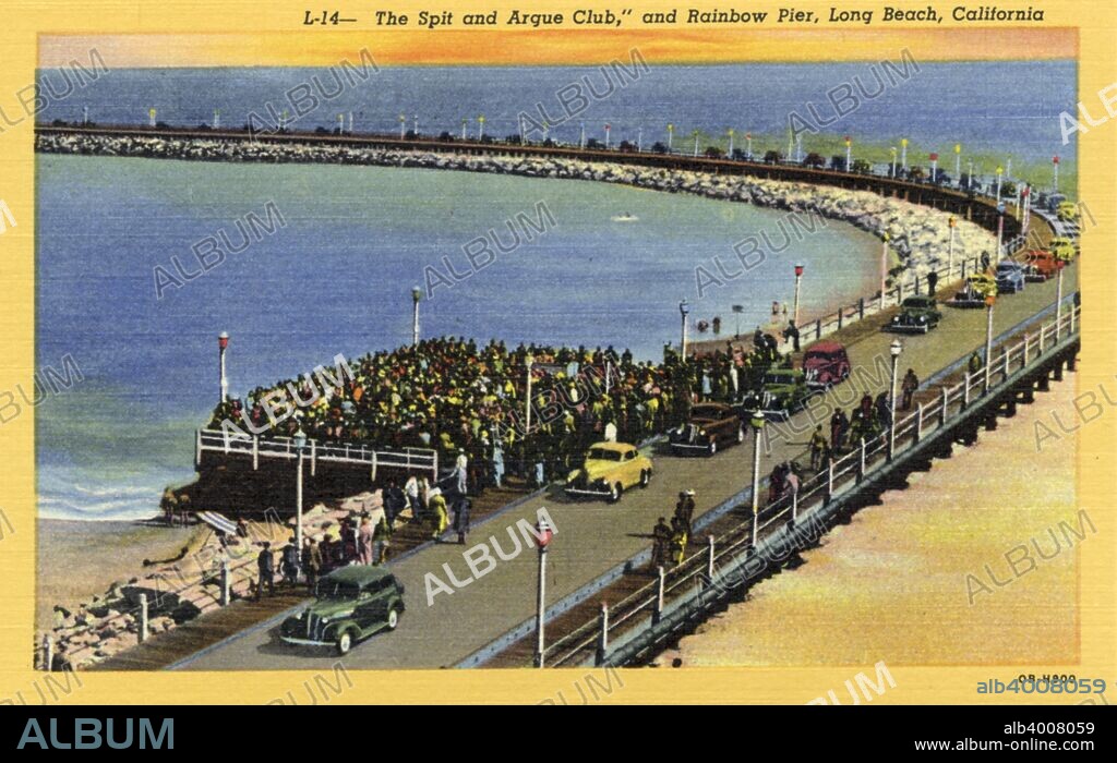 The Spit and Argue Club, and Rainbow Pier, Long Beach, California, USA, 1940. Postcard. View showing a long line of cars on Rainbow pier and a large gathering people know as the Spit and Argue Club. The sandy beach is visible as is the Pacific Ocean. Rainbow Pier was a curving breakwater built in the 1920s to protect the Long Beach Municipal Auditorium from coastal erosion.
