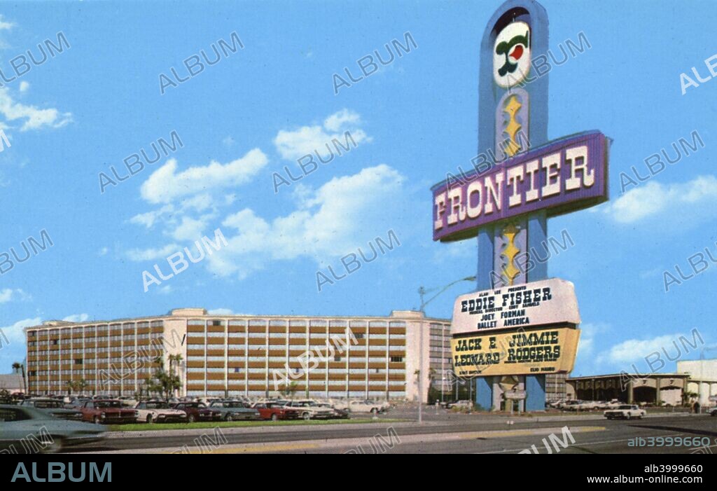 The Frontier Casino and Hotel, Las Vegas, Nevada, USA, 1967. Vintage postcard showing the exterior of the Frontier Casino and Hotel. The giant neon sign is in the foreground. Carss are visible in the parking lot. Opened in 1942, the Frontier was the second hotel and casino to be built on the Las Vegas Strip. It closed in 2007.